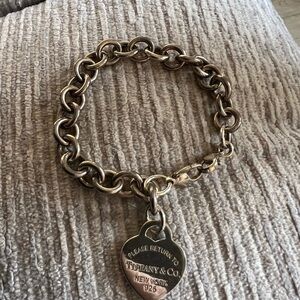 Tiffany & Co. Sterling Silver heart charm & Bracelet, fits a 7 inches wrist.
